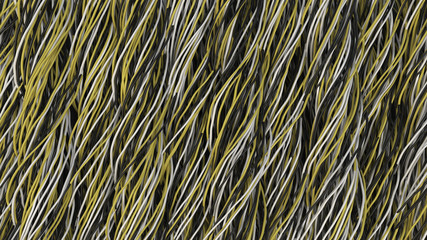 Twisted black, white and yellow cables and wires on black surface