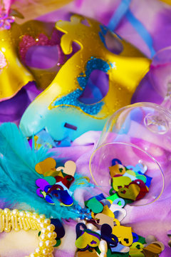 Carnival party background with confetti, masks and accessories