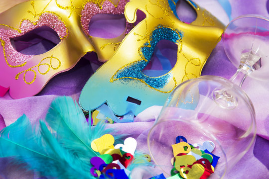 Carnival party background with confetti, masks and accessories