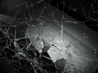 Damaged or broken glass on black