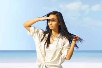 Fototapeta na wymiar Portrait of young Asian girl on the beach