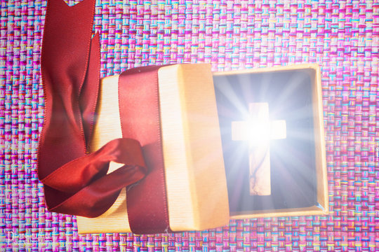 Cross shines inside gift box