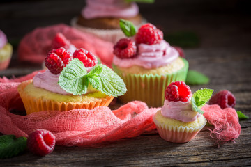 Delicious cupcake with fresh fruits and pink cream