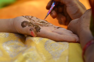 applying henna on hand, Hindu wedding ,Rajasthan, India