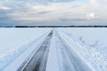 Straight road in a wintry landscape