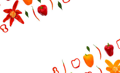 Red, orange yellow bell peppers (Capsicum annuum) and red chili pepper (Capsicum frutescens) with green leaves on a white background with space for text. Top view, flat lay