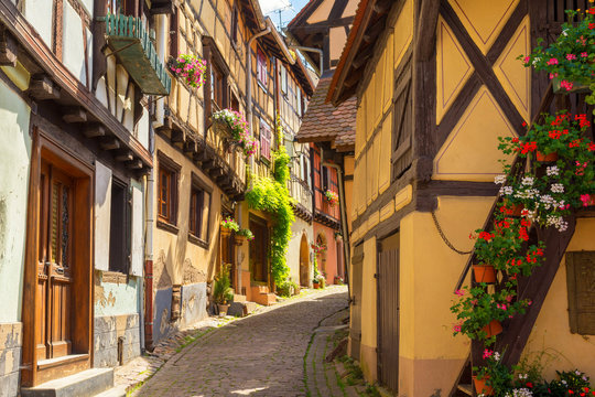 romantic alley in medieval town in Eguisheim, Alsace, France