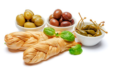 Smoked braided cheese and olives on white background
