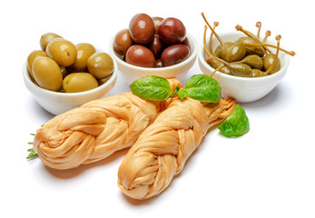 Smoked braided cheese and olives on white background