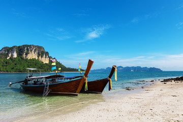 Naklejka na ściany i meble Longtale boats at the beautiful beach, Thailand
