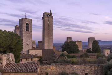 Fototapeta na wymiar Delicate sunset on the towers, San Gimignano, Siena, Tuscany, Italy