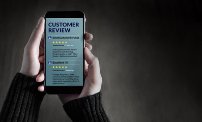 Customer Experience and Online Review Concept. Female holding SmartPhone to Reading Customer Review...