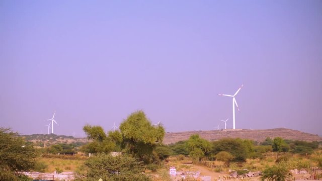 windmills in the jaisalmer wind farm in rajasthan india. This is one of the largest onshore wind farms in the world primarily by organizations like Suzlon. These windmills show up on most of the