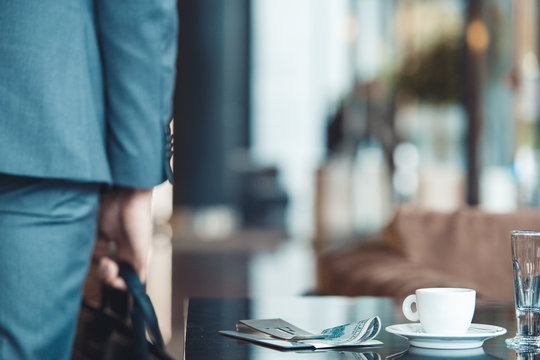 Businessman Leaving A Business Center Restaurant With Payed Bill