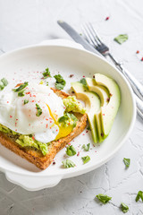 Sandwich with avocado and poached egg