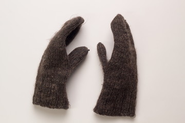 Woolen mittens on a white background