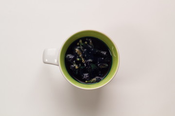 Blue Cup with tea on white background