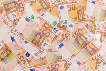 Pile of 50 euro as background. Euro currency banknotes stack. Money bank finance business.
