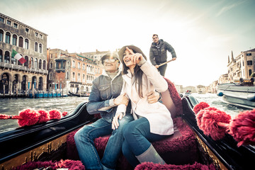 Couple sailing on venetian gondola © oneinchpunch