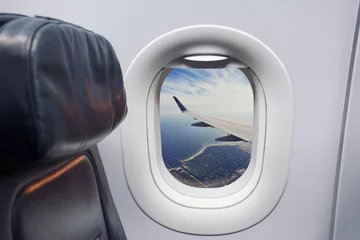 Poster Vliegtuig airplane seat and window inside an sea