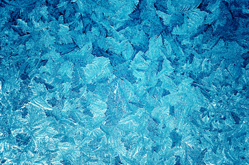 Icy frosty pattern on a window.Abstract background.