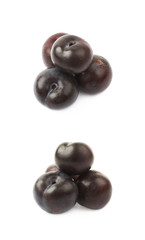 Pile of black plums isolated