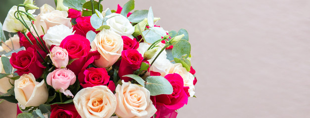 Bouquet of flowers - a composition of multi-colored roses. Background for the postcard.