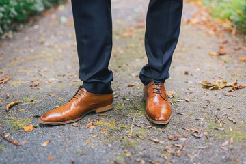 groom brown shoes close up
