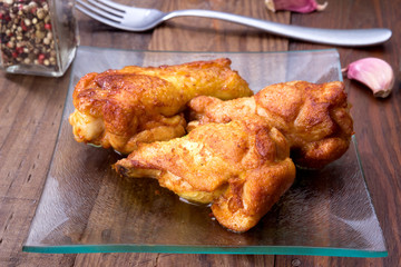 chicken wings cooked on rustic wooden board