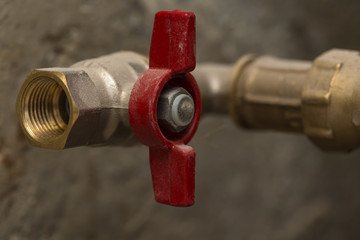 Closed red ball valve brass on pipe