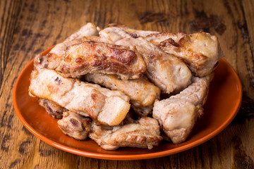 Homemade pork rib stew with potatoes on wooden board
