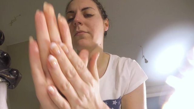 Woman wakes from sleep and she was cleansing her face