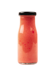 Red sauce in a glass bottle isolated