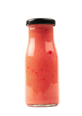 Red sauce in a glass bottle isolated