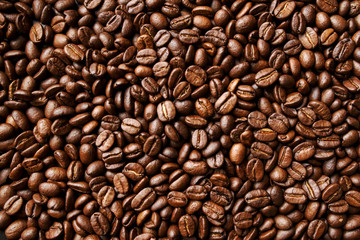 Roasted coffee beans background. Abstract texture pattern