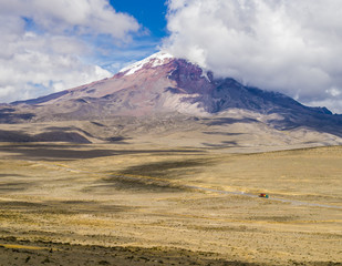 Fototapeta na wymiar Panoramic view of snow capped Chimborazo volcano, the farthest point from Earth's center, Cordillera Occidental of the Andes, Ecuador 