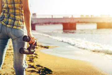 Unrecognizable Young Girl Standing On The Shore And Holding Binoculars, Rear View. Search Scout Travel Concept