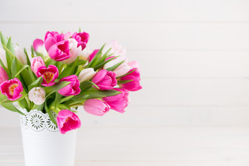 Pink tulip on the white background. Easter background