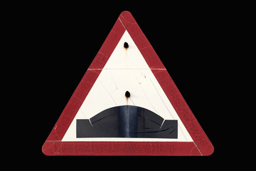 Old dirty rusty triangular red border road sign 'Hump'