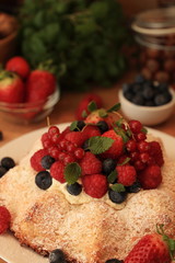 Angel cake with berries on a table