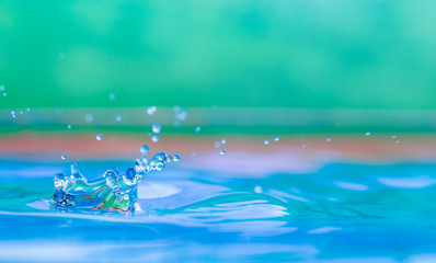 Naklejka na ściany i meble Colorful water droplet splash photograph