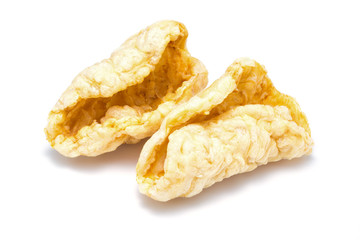 pile of dried fish maw on white background