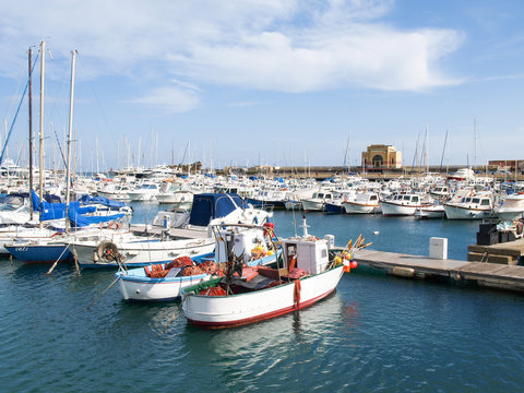 Various boats moored in the harbor
