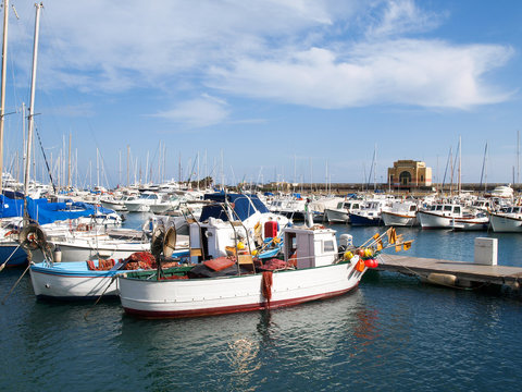 Various boats moored in the harbor