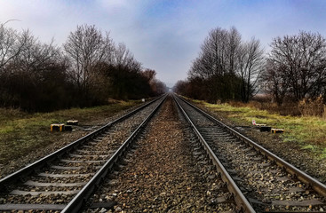 Fototapeta na wymiar Landscape of railway rails in foggy weather