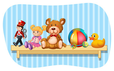 Many types of toys on wooden shelf