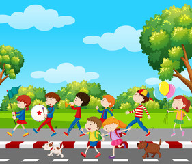 Obraz na płótnie Canvas Children in band marching in park