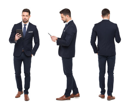 Young stylish businessman using tablet front, side, rear view isolated