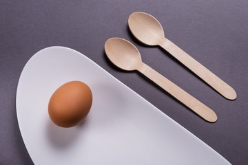 Simple breakfast, boiled egg on white porcelain
