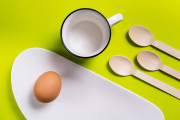 Simple breakfast, boiled egg on white porcelain